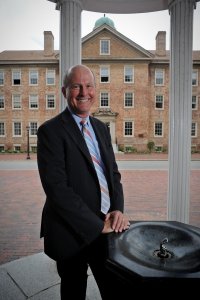 Provost James Dean at the Old Well at the University of North Carolina at Chapel Hill. In background is South Building the main administrative building.
